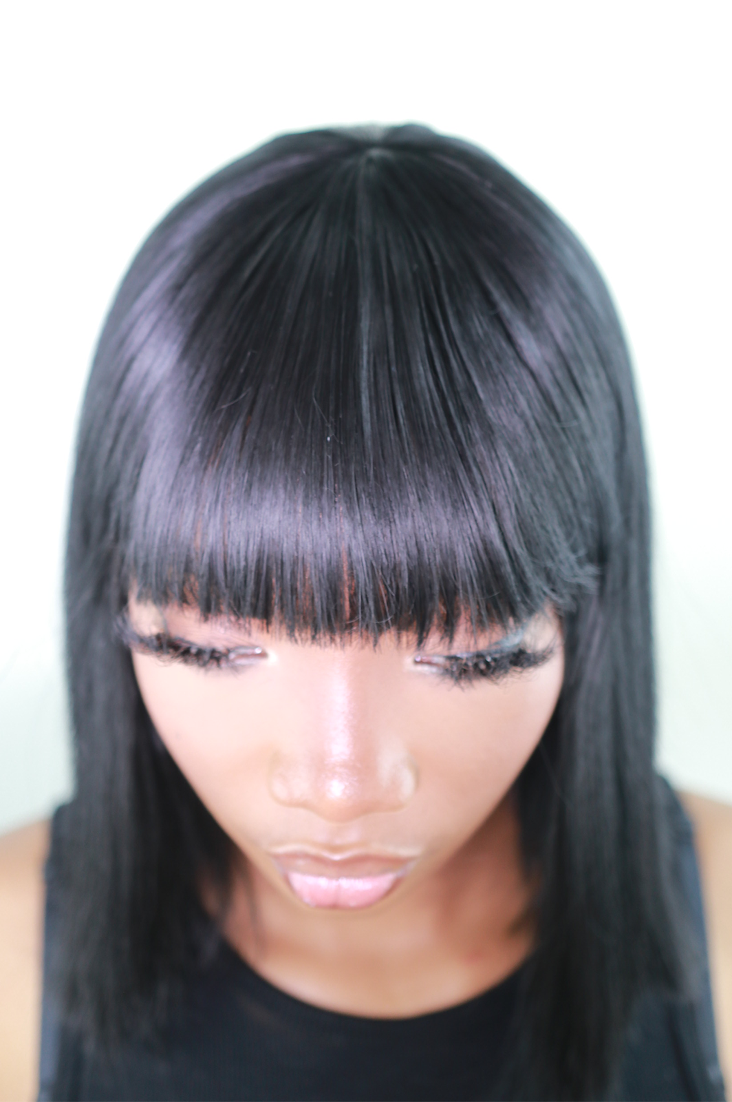 Iskaba Bob: 12-Inch Long Black Heat Resistant Synthetic Wig with Bangs