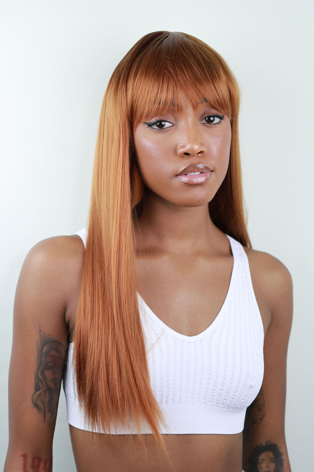 Iskaba Spice: 22-Inch Long Black Heat Resistant Synthetic Wig with Bangs